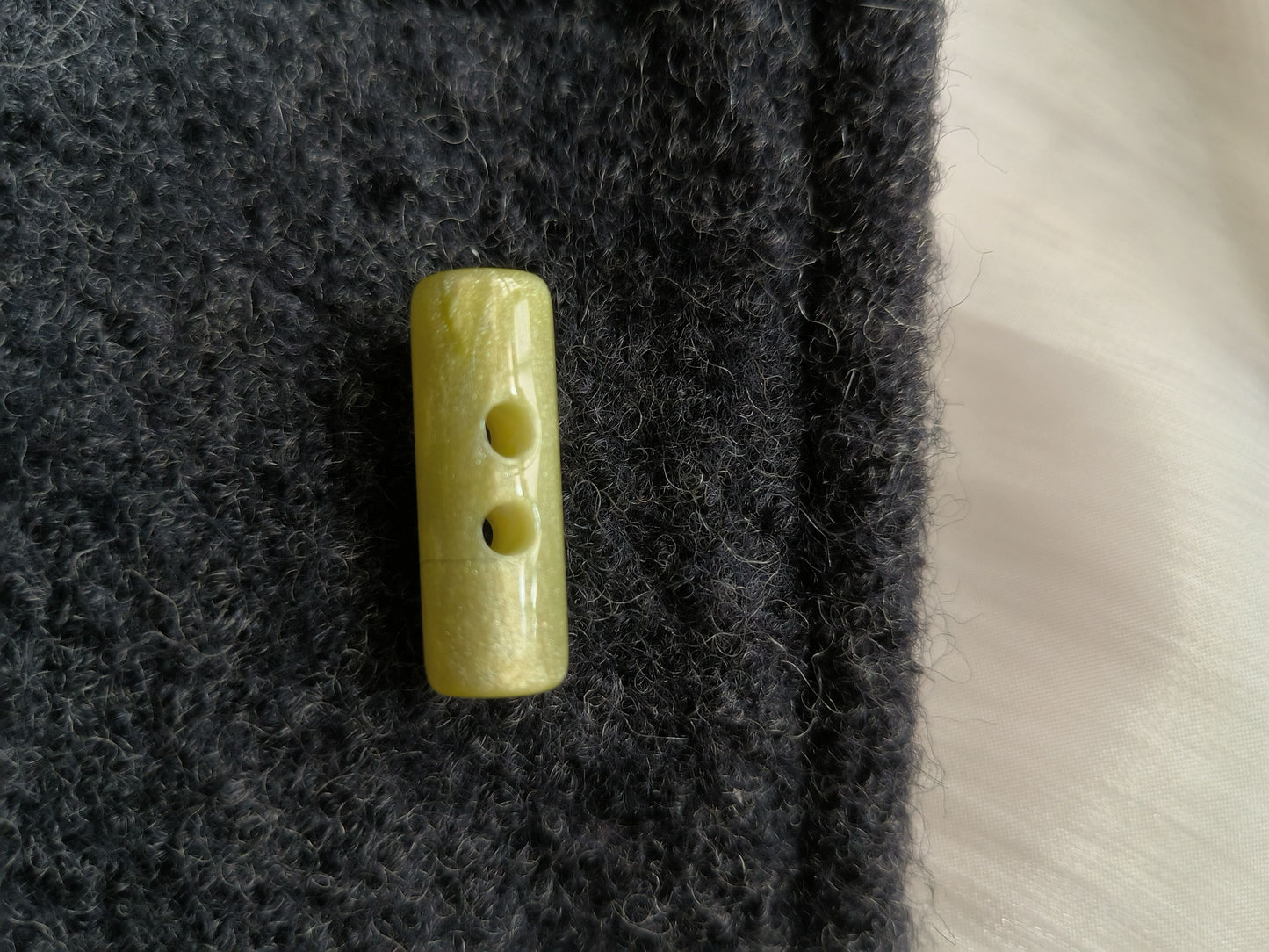 Round cowl coat button