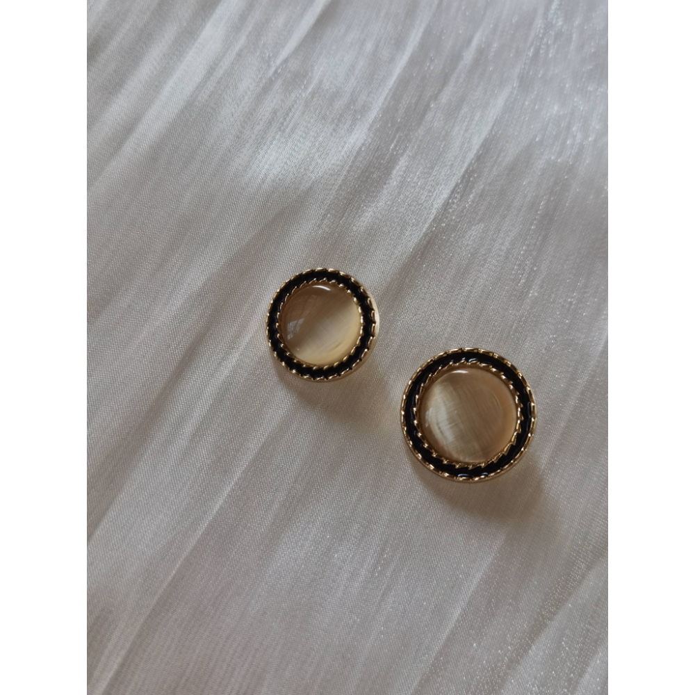 Black velvet trimmed amber metal buttons