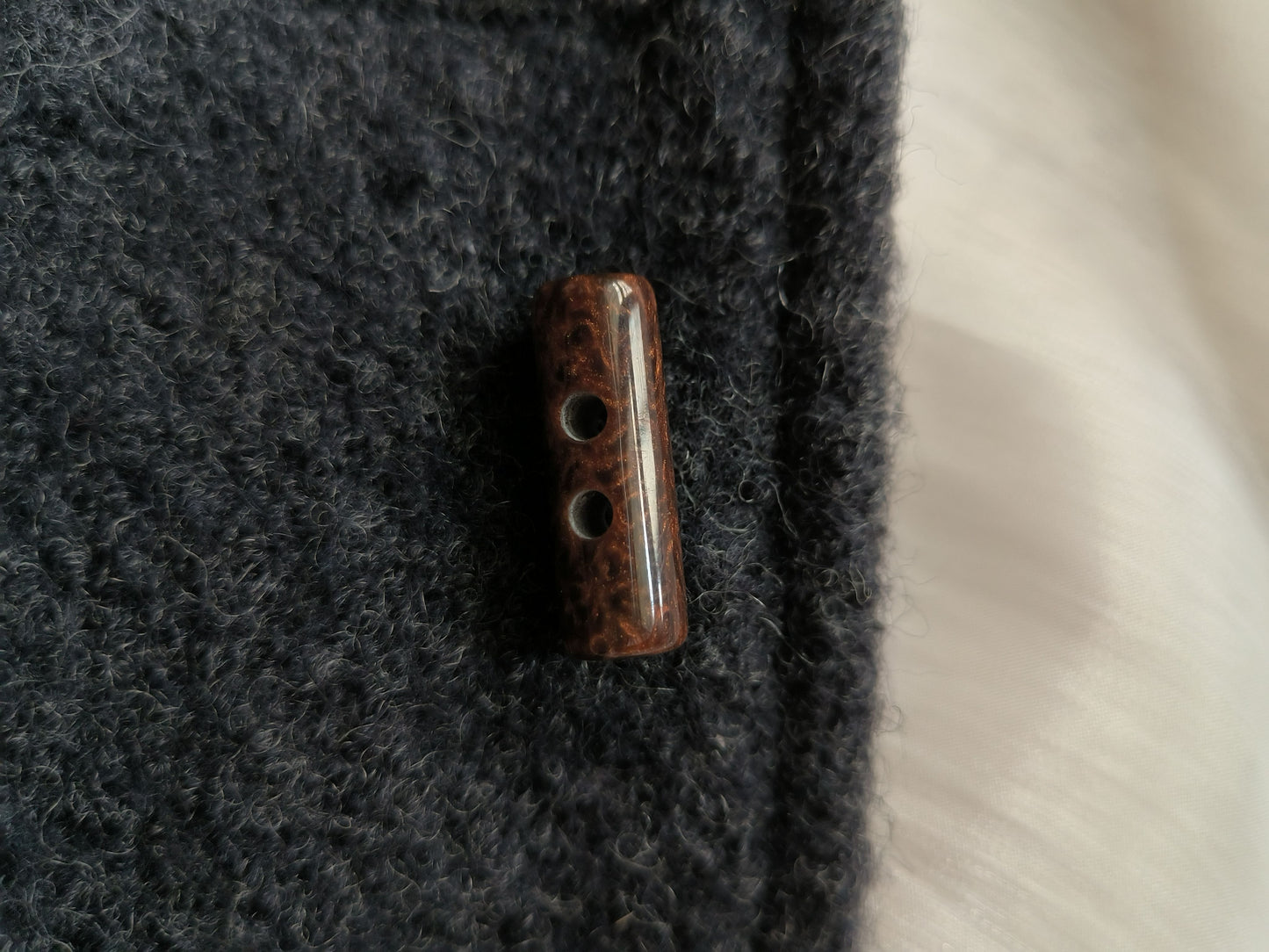 Round cowl coat button