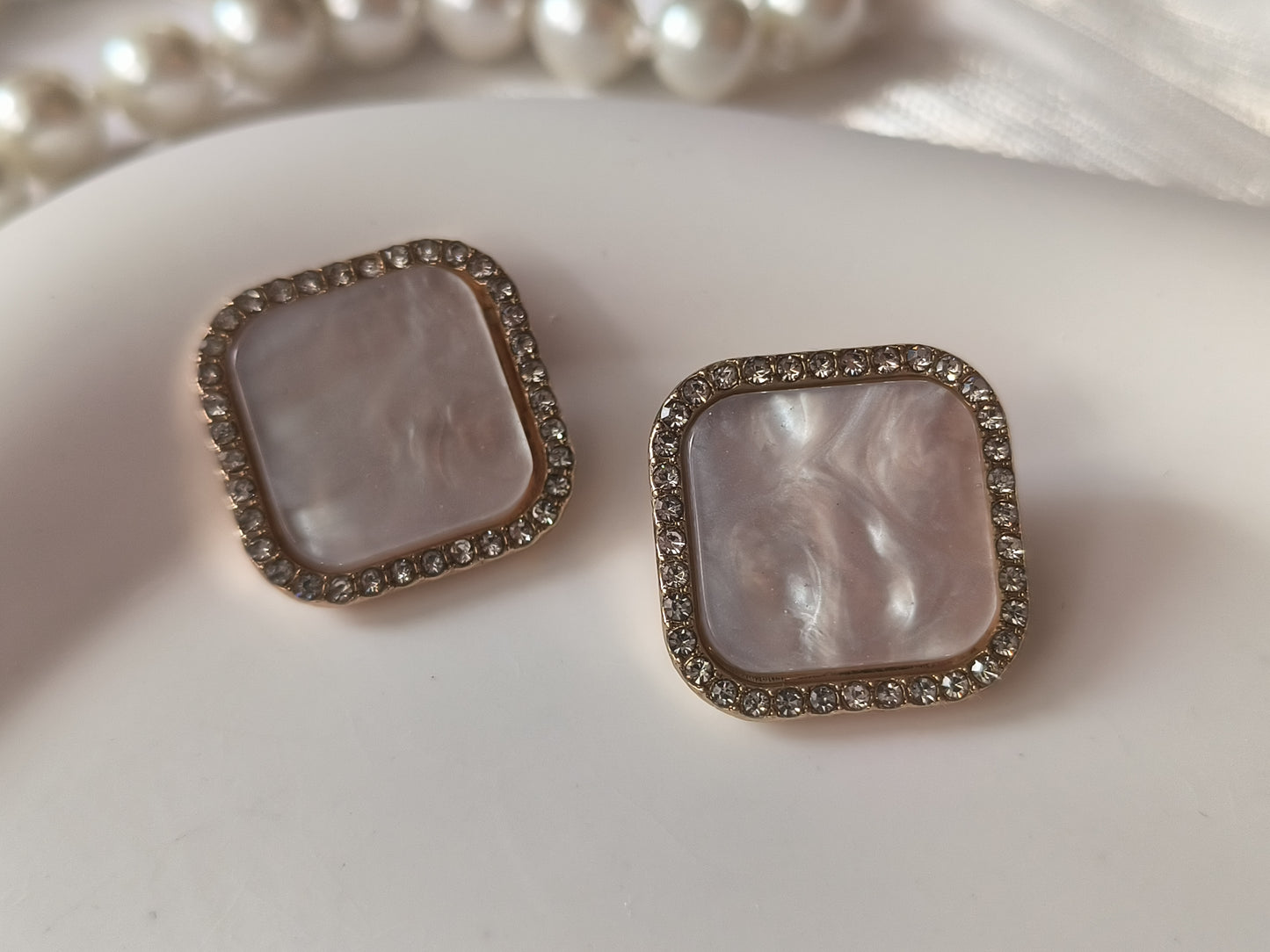 Dreamy pink buttons with gold trim and diamonds