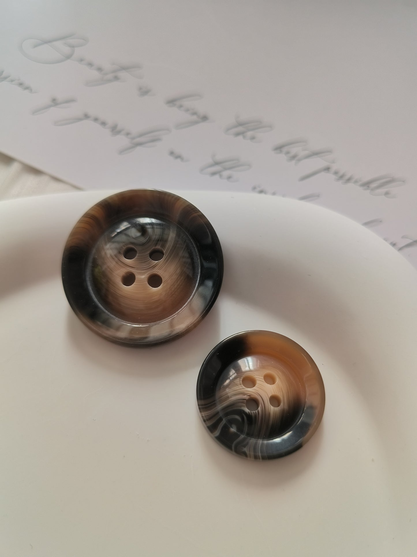 Glossy amber patterned round button