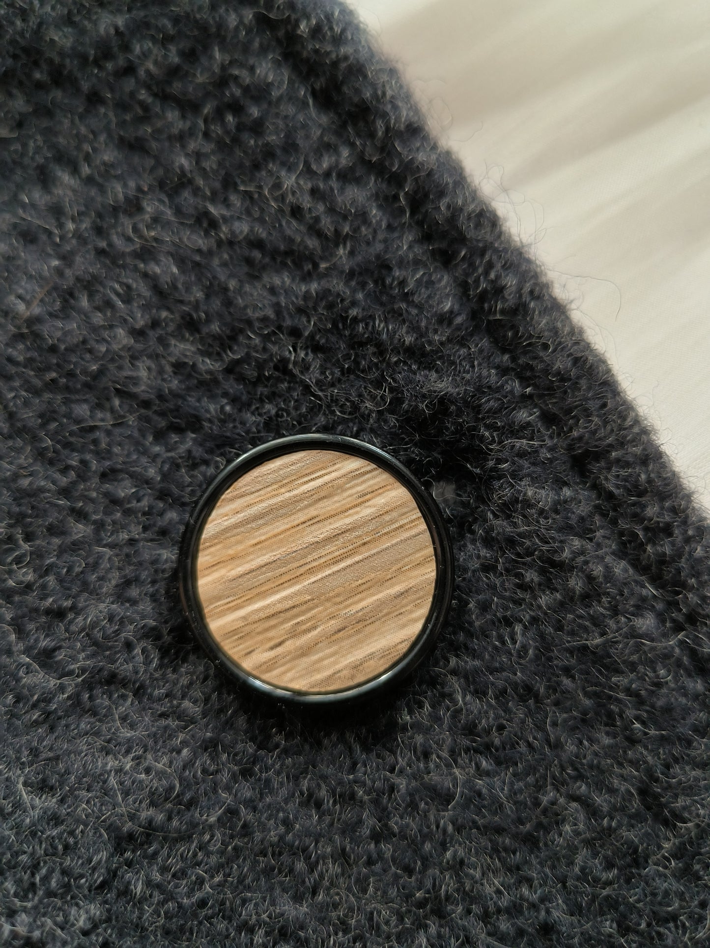 Round button in wood-like material