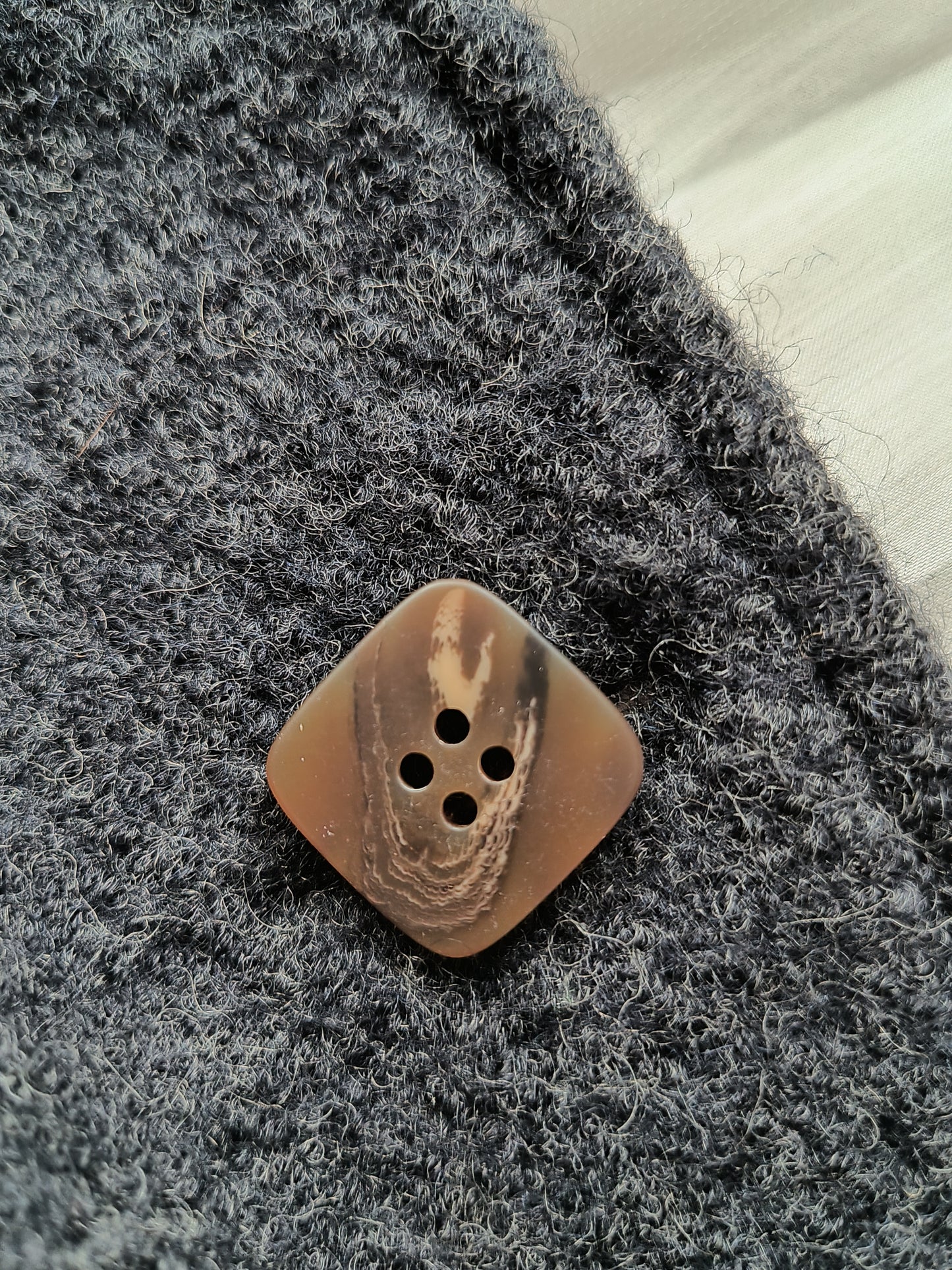 Brown water ripple button