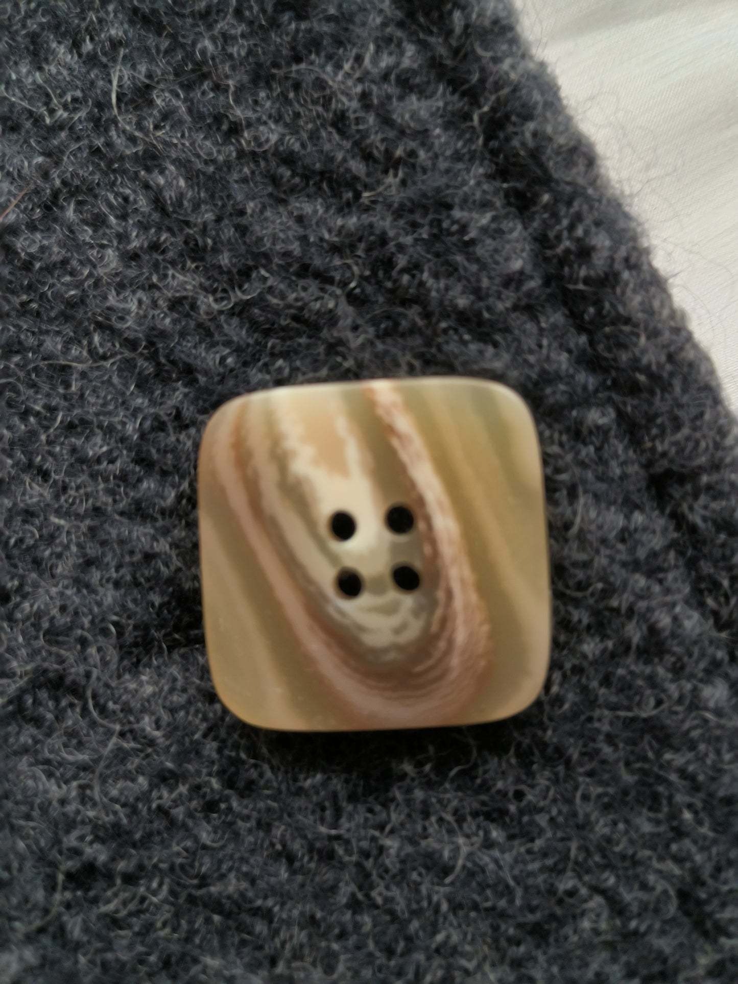 Brown water ripple button