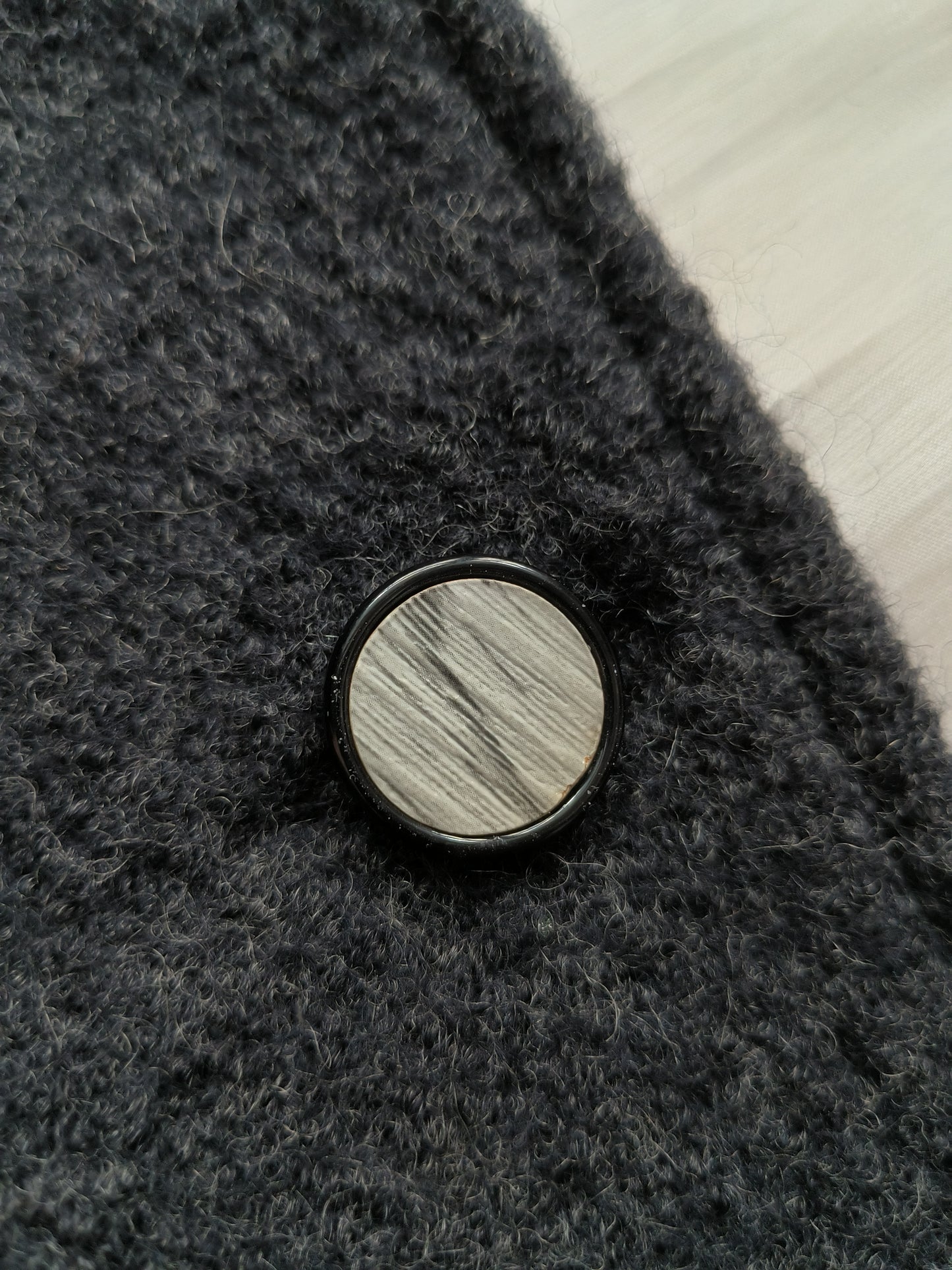 Round button in wood-like material