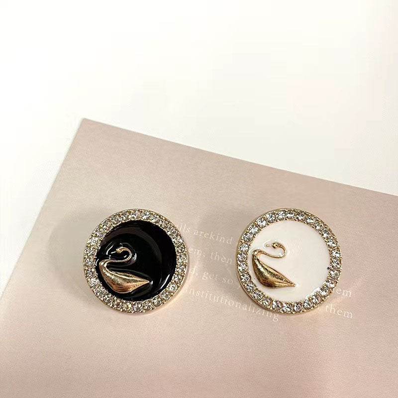 Rhinestone-bound swan buttons