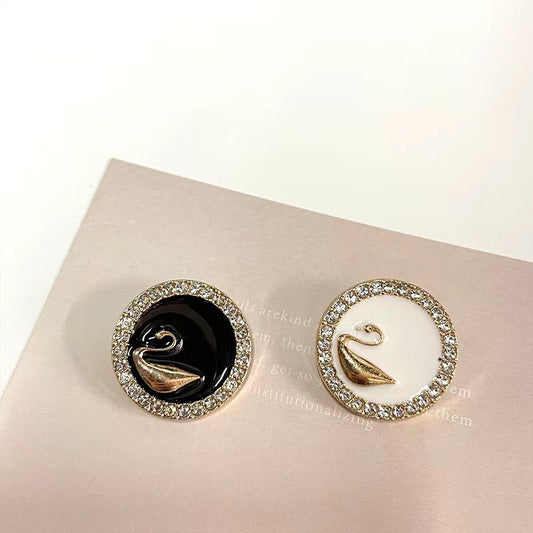 Rhinestone-bound swan buttons