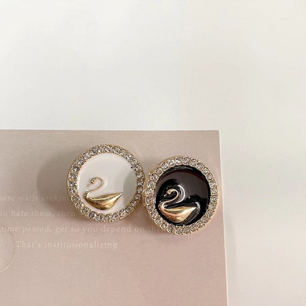 Rhinestone-bound swan buttons