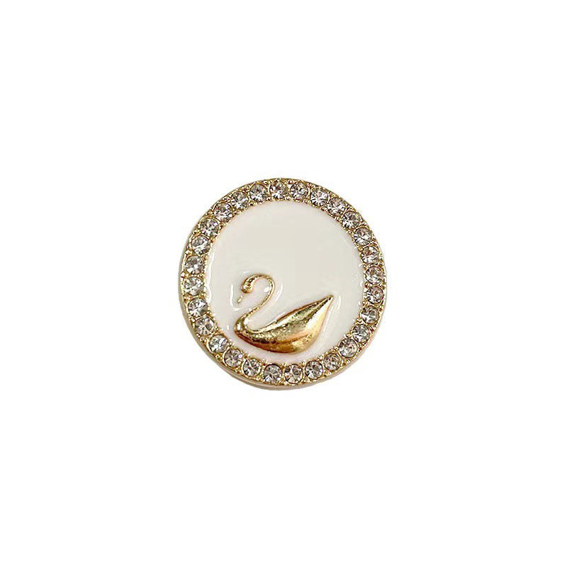 Rhinestone-bound swan buttons